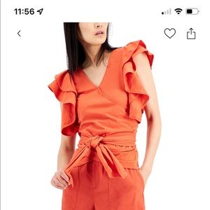 Black ruffle sleeve wrap blouse.